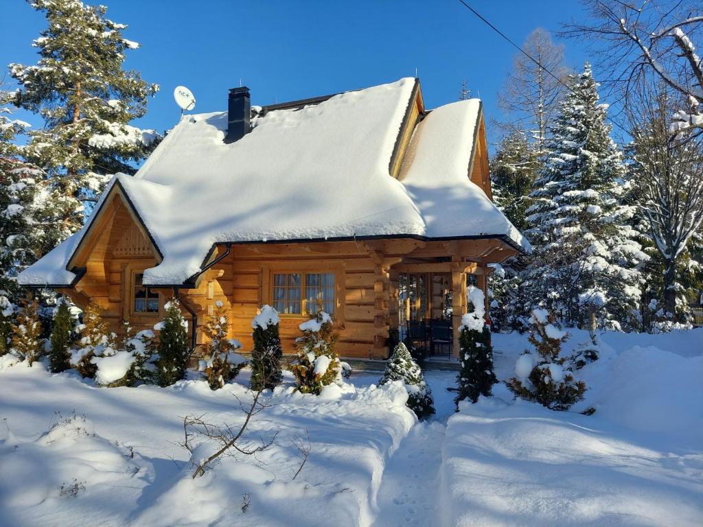 a log cabin in the snow at BIAŁY PUCH in Zakopane