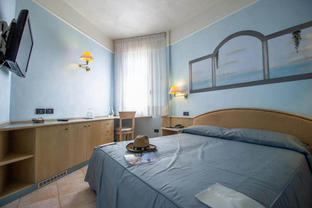 TV a/nebo společenská místnost v ubytování Hotel Universo