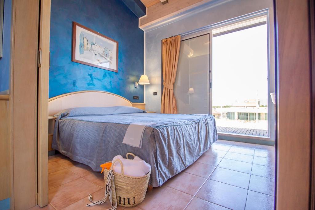 Postel nebo postele na pokoji v ubytování Hotel Universo