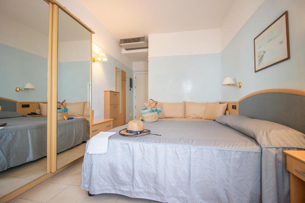 Postel nebo postele na pokoji v ubytování Hotel Universo
