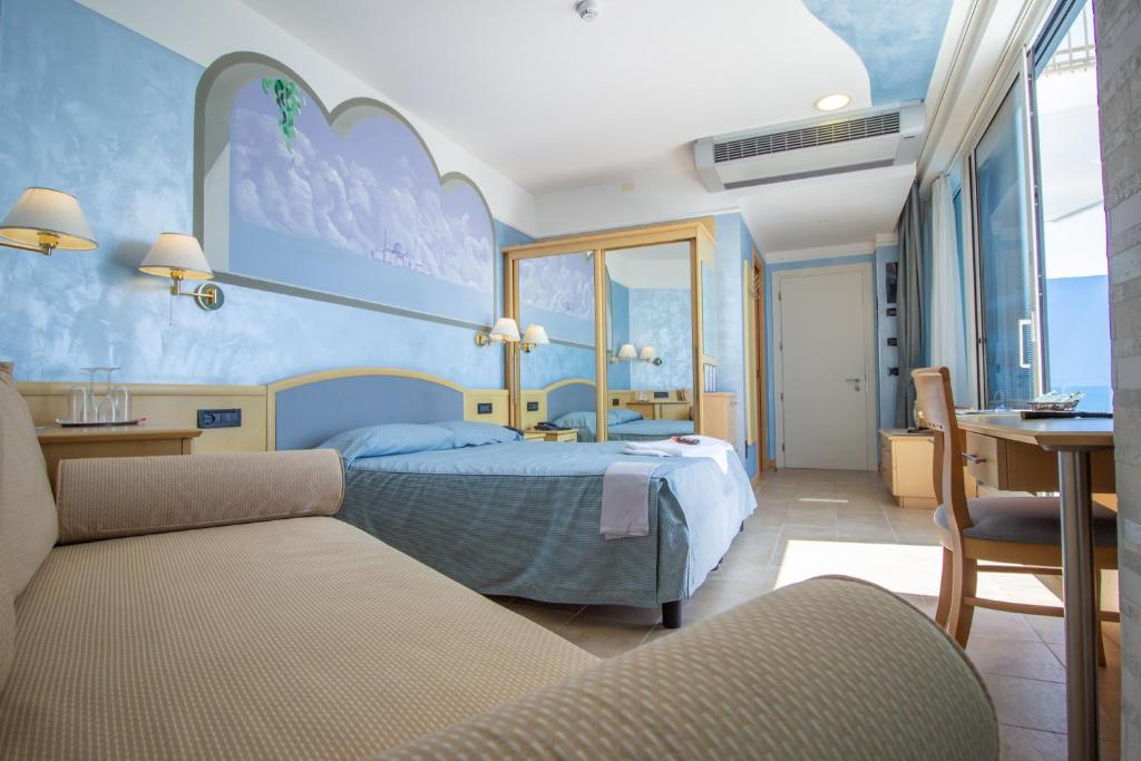 Postel nebo postele na pokoji v ubytování Hotel Universo