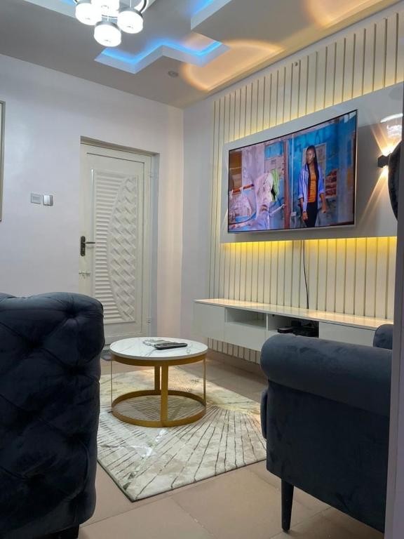 a living room with a couch and a table at GS HOMES in Lagos