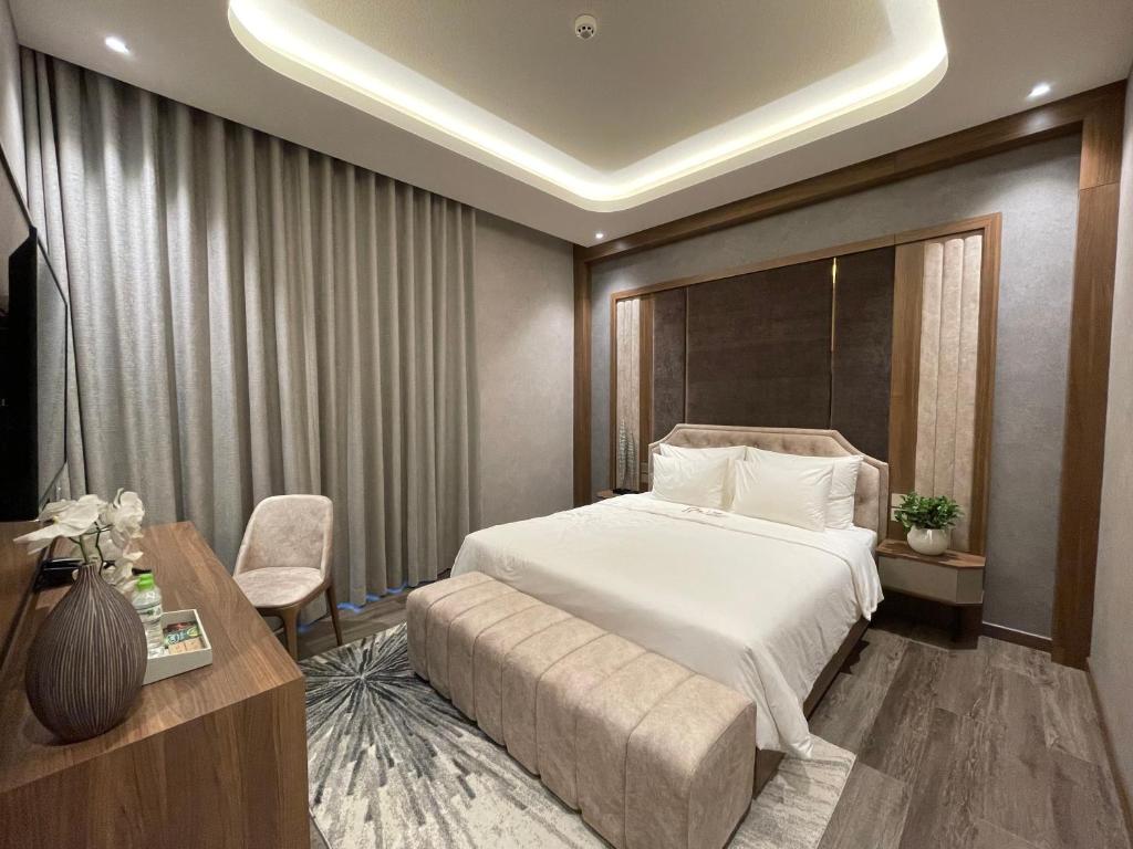 Giường trong phòng chung tại The Malibu Hotel Saigon