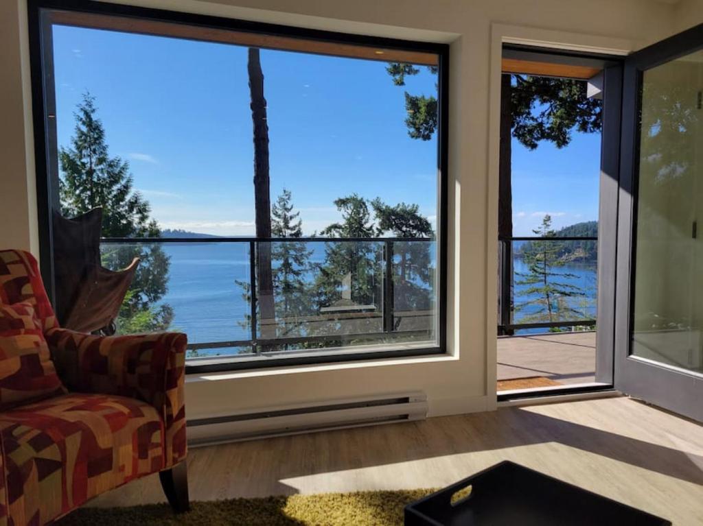 a living room with a view of the water at J and Js in Bowen Island