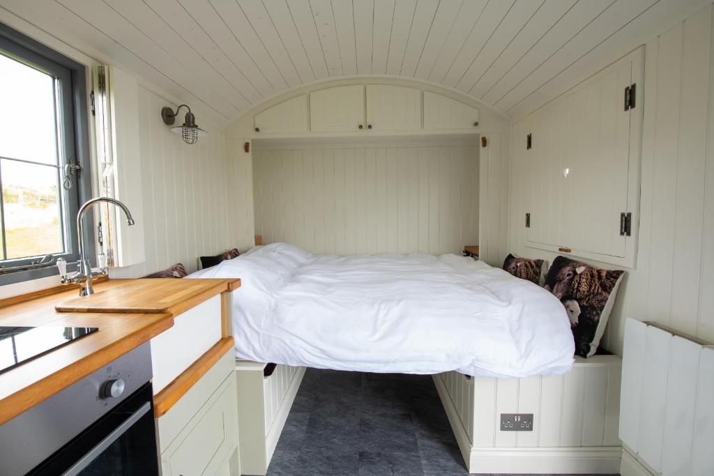 Postel nebo postele na pokoji v ubytování Shepherds Hut