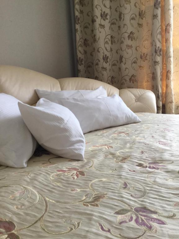 Łóżko lub łóżka w pokoju w obiekcie President Apartments by WarsawResidence Group