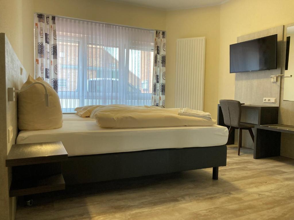 Postel nebo postele na pokoji v ubytování Landhotel Vosse-Schepers
