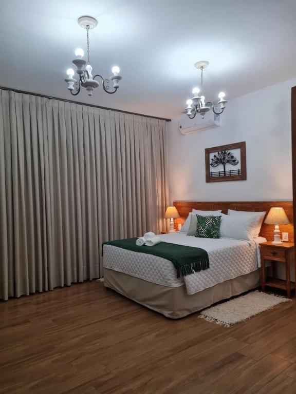Postel nebo postele na pokoji v ubytování Pousada Candelabro