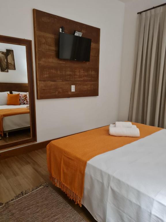Postel nebo postele na pokoji v ubytování Pousada Candelabro