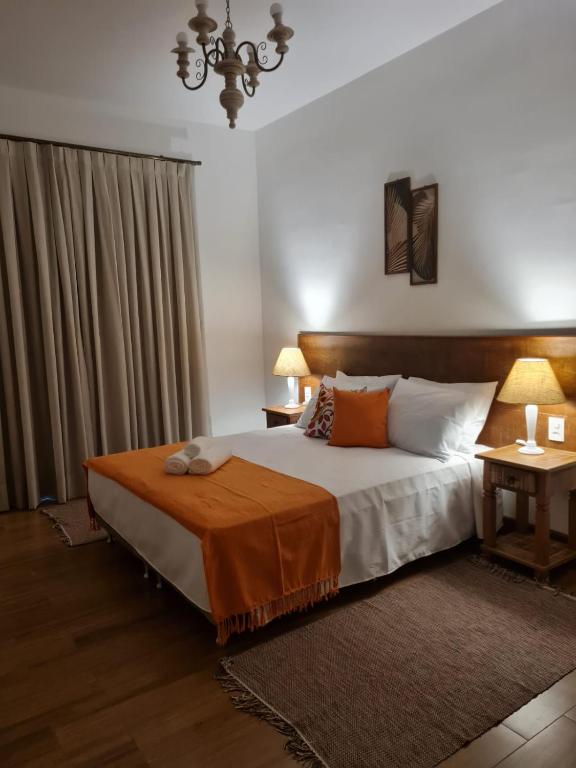 Postel nebo postele na pokoji v ubytování Pousada Candelabro