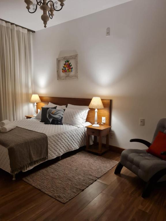 Postel nebo postele na pokoji v ubytování Pousada Candelabro