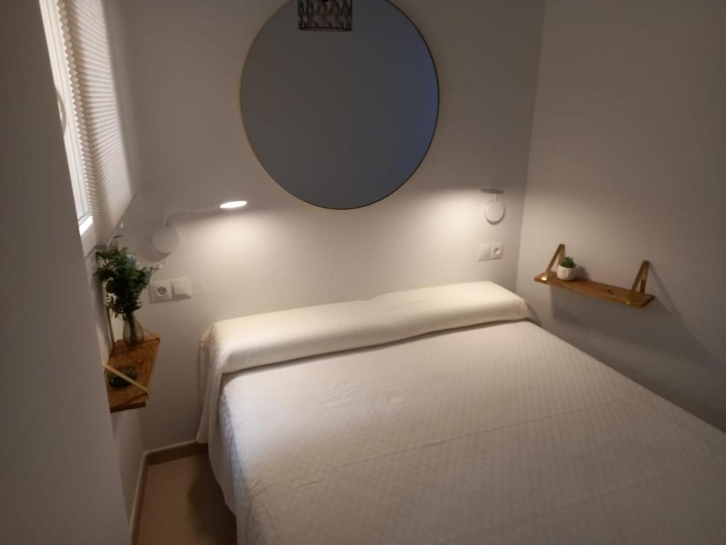 Un pat sau paturi într-o cameră la Frailes