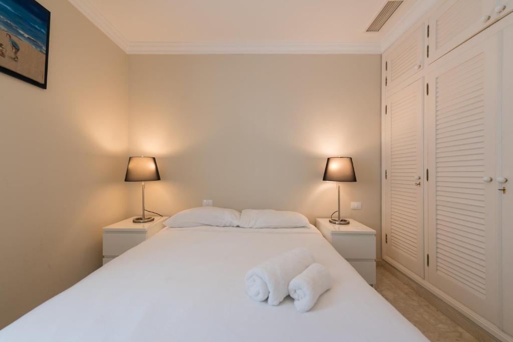 A bed or beds in a room at Casa Maspalomas private pool, Bbq and private parking