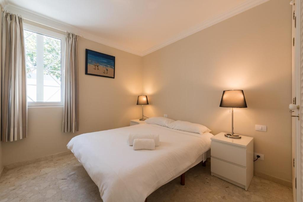 A bed or beds in a room at Casa Maspalomas private pool, Bbq and private parking