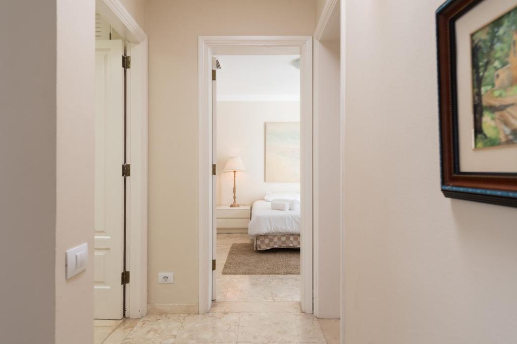 A bed or beds in a room at Casa Maspalomas private pool, Bbq and private parking