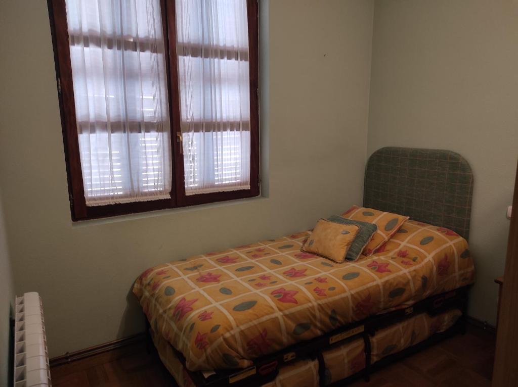 A bed or beds in a room at Apartamento Parque Europa