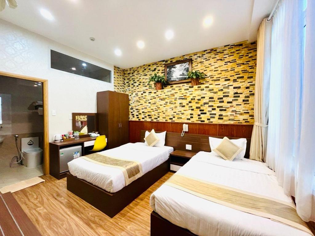 Giường trong phòng chung tại Duy Vinh Hotel Dalat