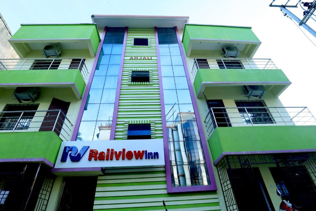 um edifício com um sinal na lateral em Railview inn Bhubaneswar em Bhubaneshwar