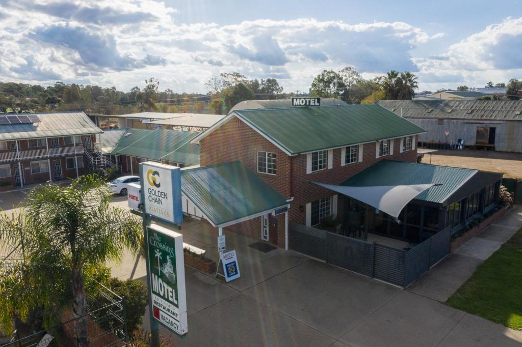 an overhead view of a building with a gas station at The Crossing Motel in Junee