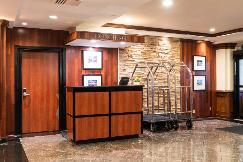 a lobby with a reception desk in a building at Crowne Plaza Newark Airport by IHG in Elizabeth