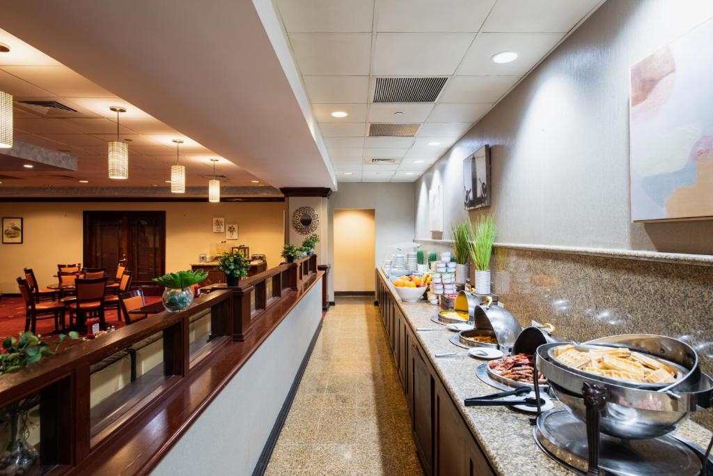 a buffet line in a hotel room with food at Crowne Plaza Newark Airport by IHG in Elizabeth
