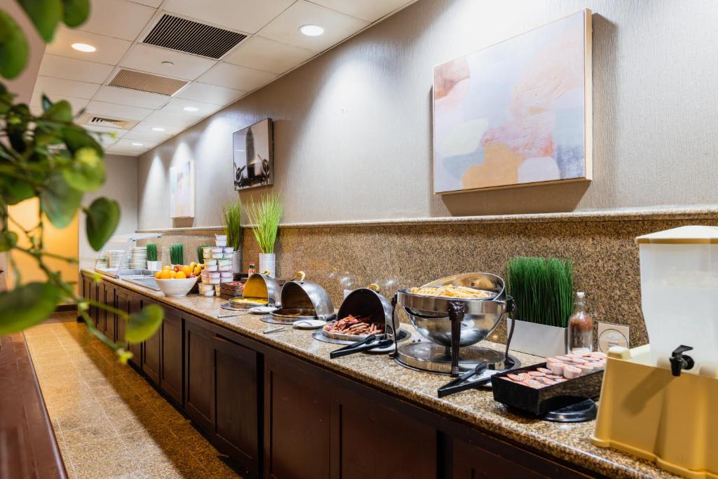 a buffet line in a hotel room with food at Crowne Plaza Newark Airport by IHG in Elizabeth