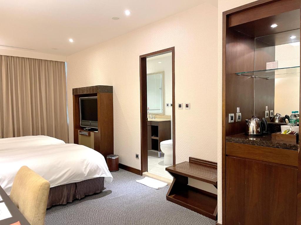 Postel nebo postele na pokoji v ubytování Hotel HD Palace