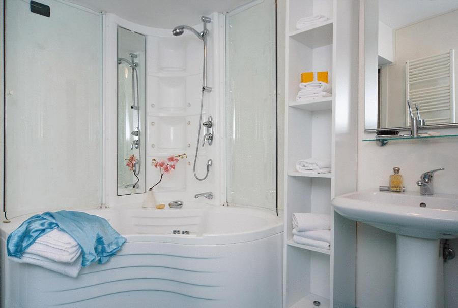 a white bathroom with a shower and a sink at La Rosa dei Venti in Venice