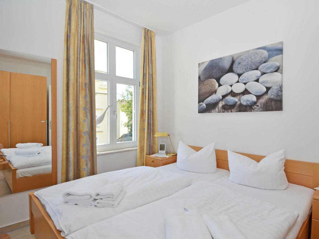Postel nebo postele na pokoji v ubytování Haus Möwe - Apt. 03