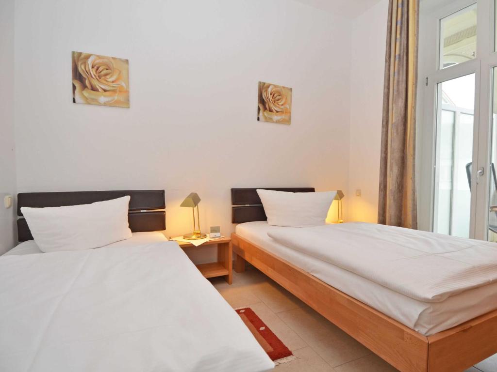 Postel nebo postele na pokoji v ubytování Haus Möwe - Apt. 03