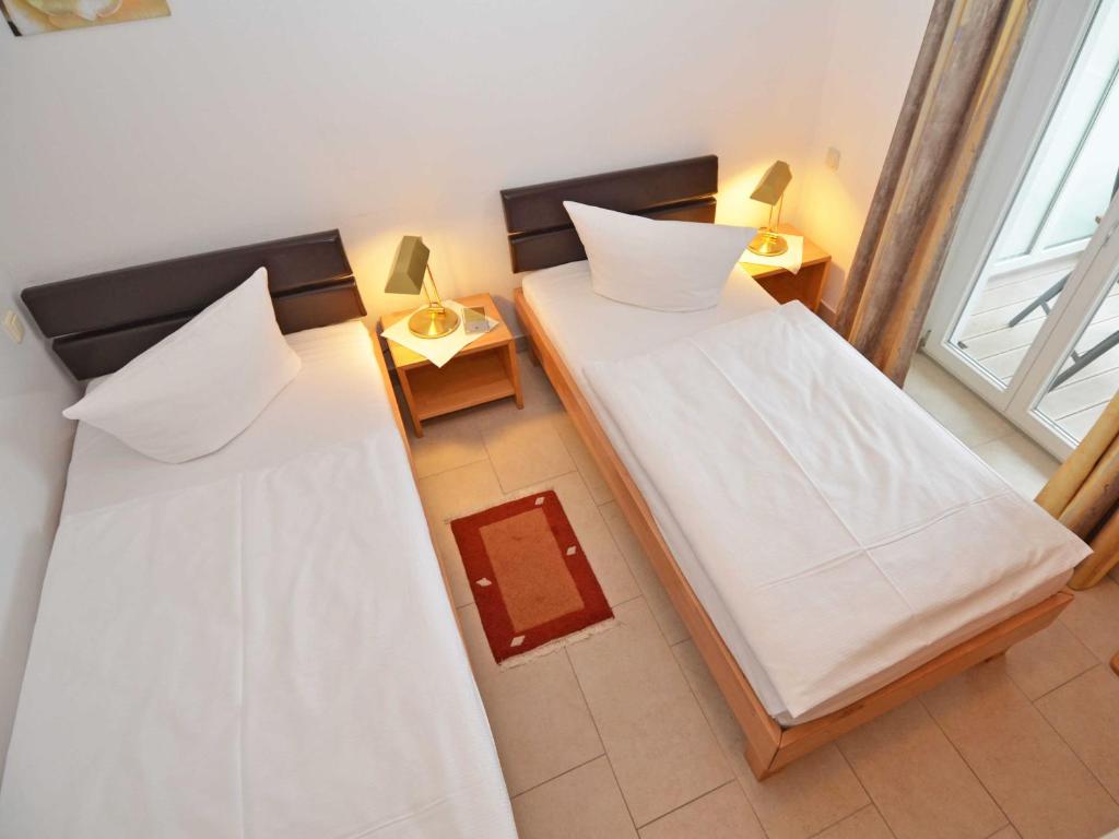 Postel nebo postele na pokoji v ubytování Haus Möwe - Apt. 03