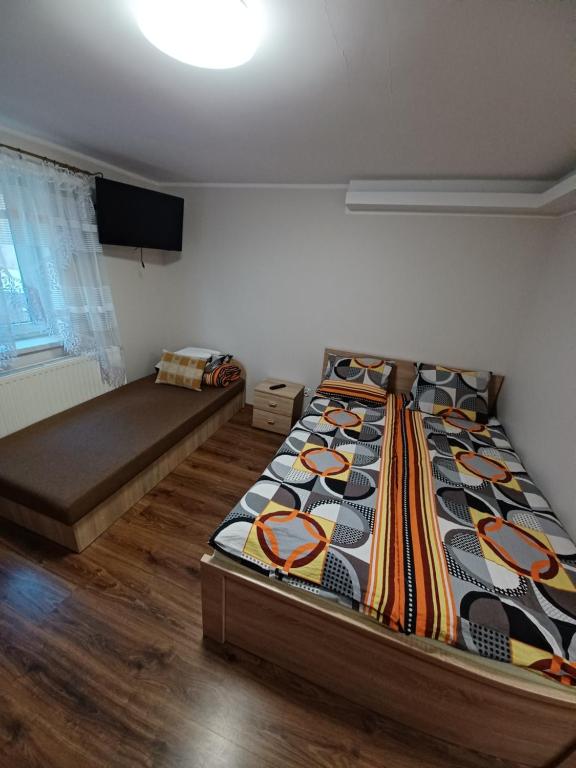 Postel nebo postele na pokoji v ubytování Willa Do-Dar