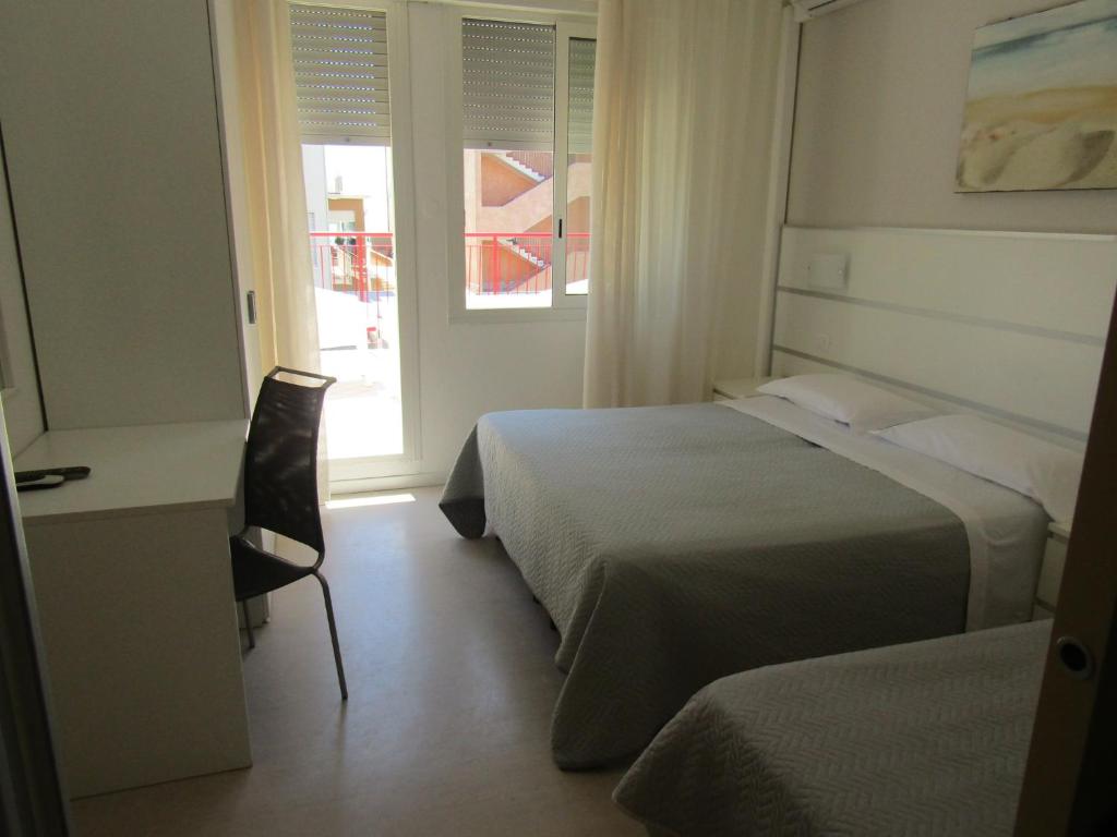 Postel nebo postele na pokoji v ubytování Hotel Atene
