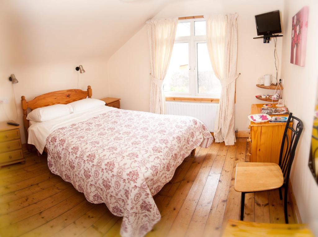 Postel nebo postele na pokoji v ubytování Tower Lodge B&B