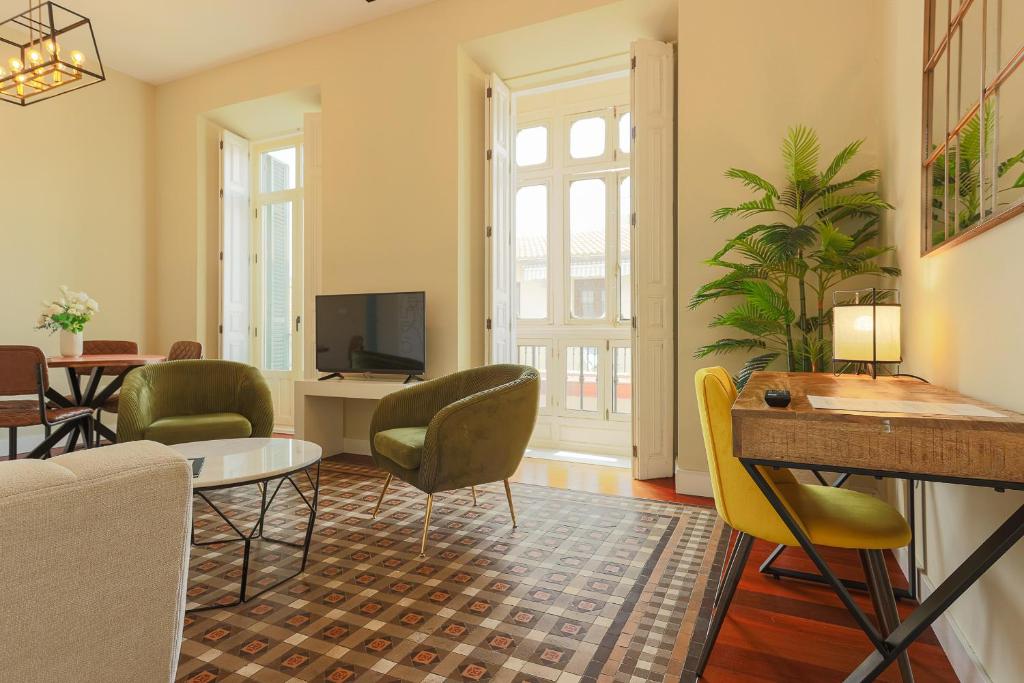 TV a/nebo společenská místnost v ubytování Madeinterranea Apartments