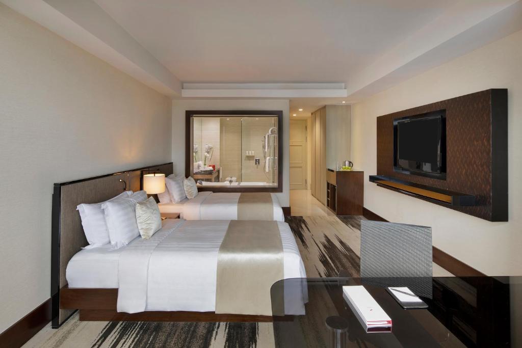 TV a/nebo společenská místnost v ubytování Gran Melia Jakarta