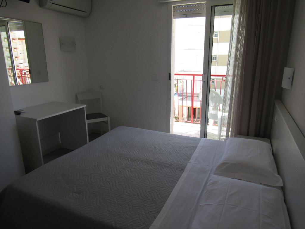Postel nebo postele na pokoji v ubytování Hotel Atene