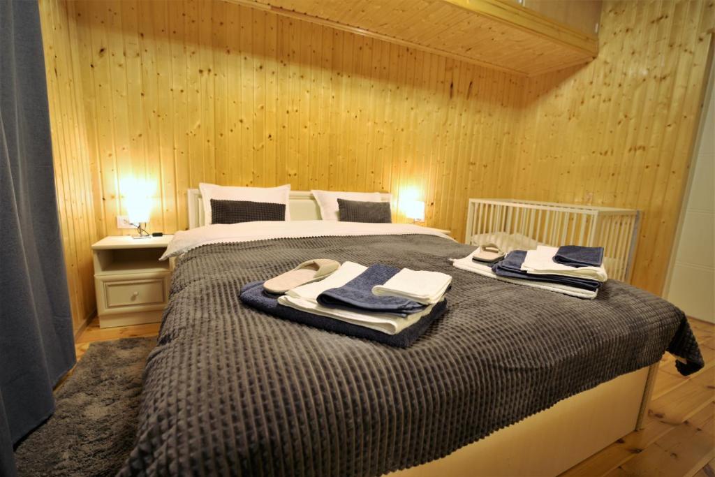 a bedroom with a bed with towels on it at East side in Tervola with sauna and free parking in Tervola