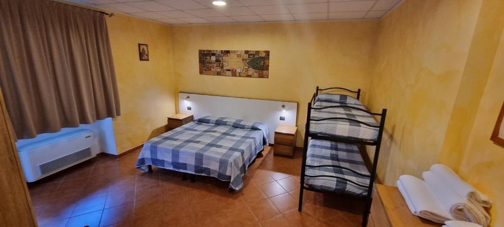 Postel nebo postele na pokoji v ubytování Albergo Etrusco