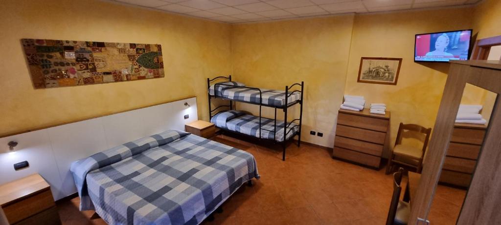 Postel nebo postele na pokoji v ubytování Albergo Etrusco
