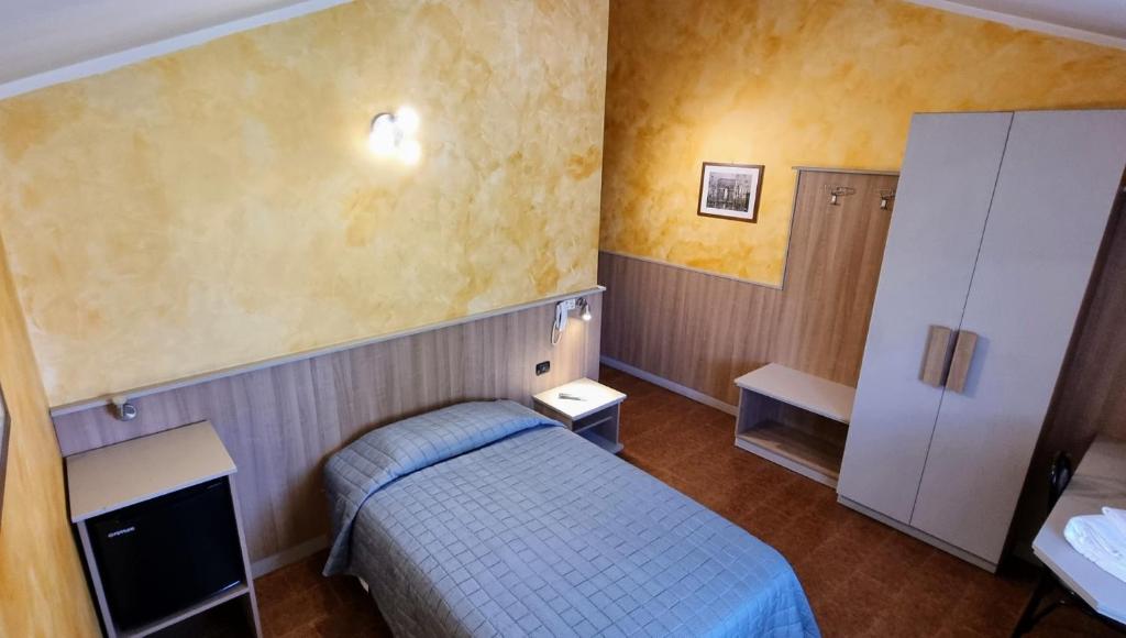 Postel nebo postele na pokoji v ubytování Albergo Etrusco