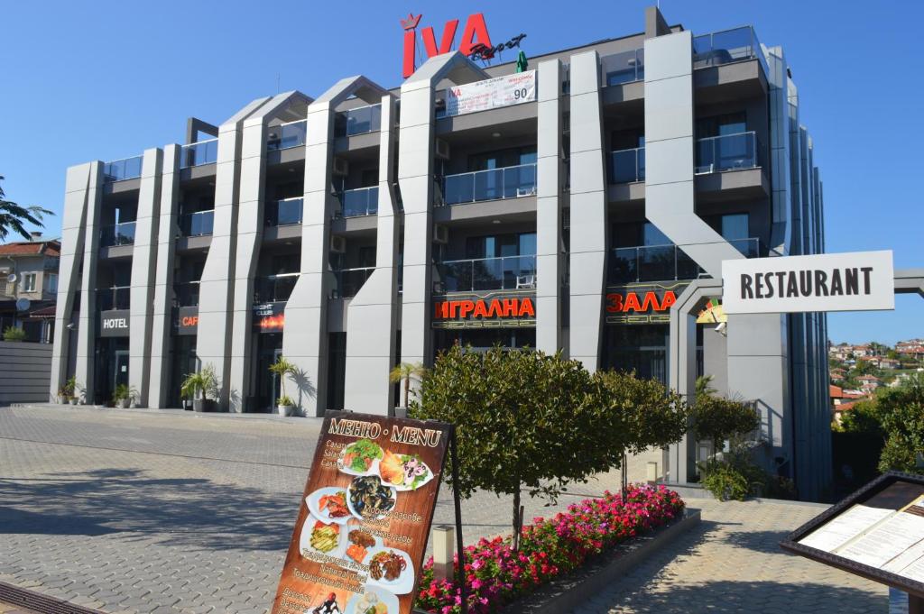 a building with a sign in front of it at Iva Resort in Byala