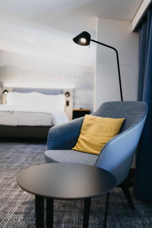 Postel nebo postele na pokoji v ubytování OREA Hotel Špičák Šumava