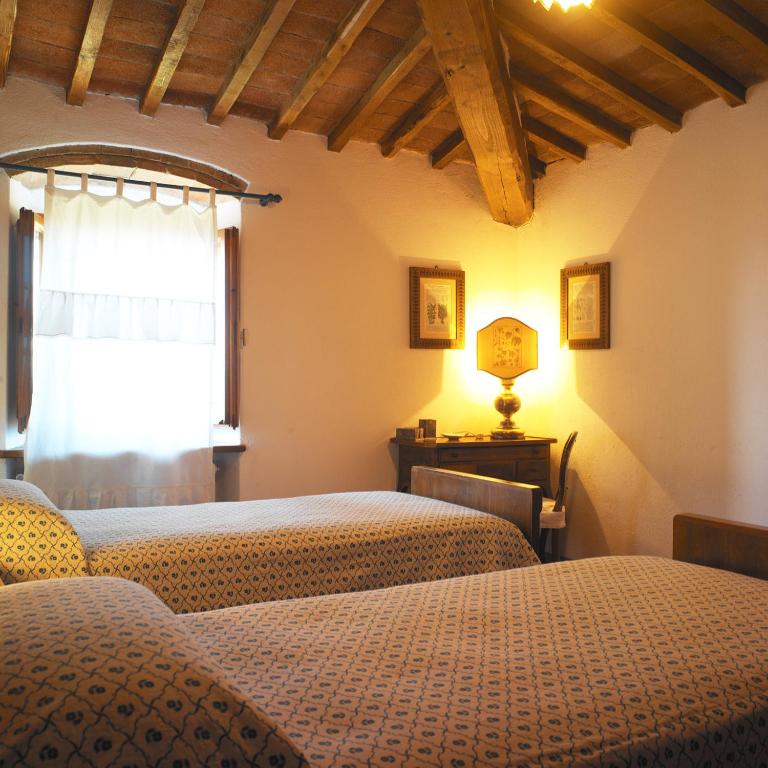 Łóżko lub łóżka w pokoju w obiekcie Casa Ercole Farm Stay