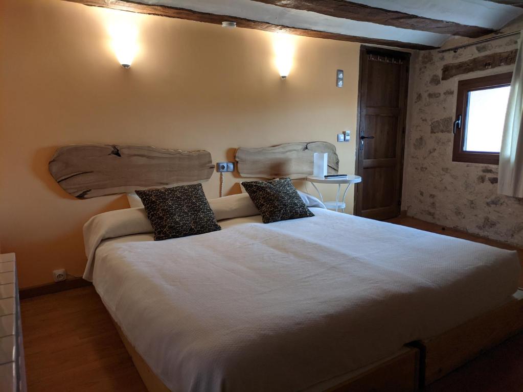 Postel nebo postele na pokoji v ubytování Xana Casa Rural