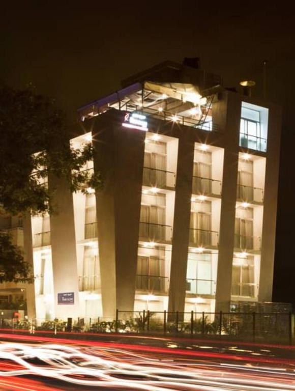 a building at night with cars in front of it at The Park Slope Hotel in Bangalore