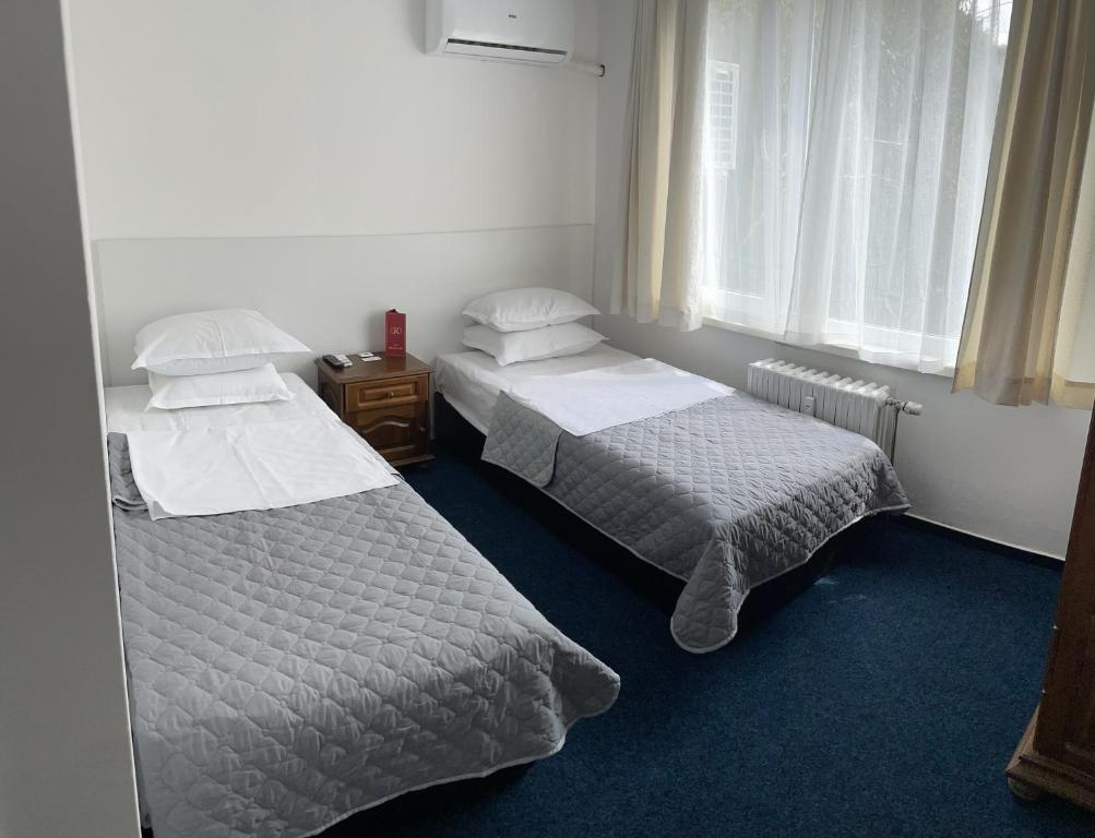Postel nebo postele na pokoji v ubytování Hotel Rotasar