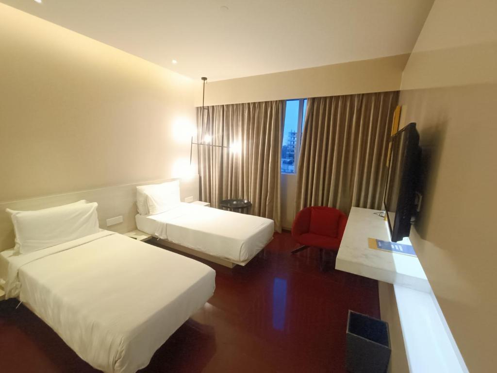 Postel nebo postele na pokoji v ubytování Boulevard by Design Hotel Chennai