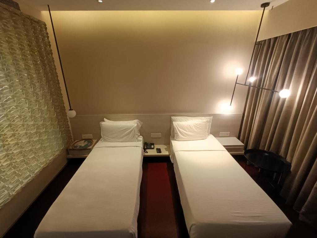 Postel nebo postele na pokoji v ubytování Boulevard by Design Hotel Chennai