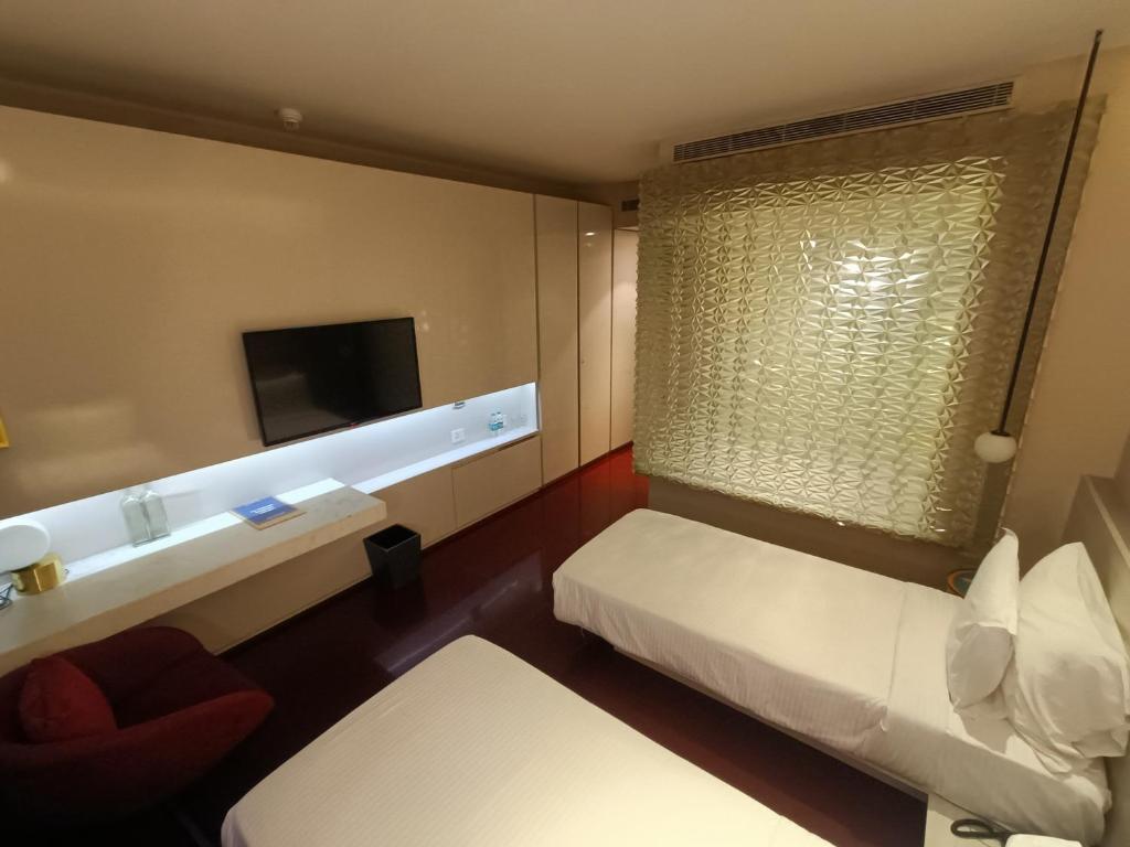 Postel nebo postele na pokoji v ubytování Boulevard by Design Hotel Chennai